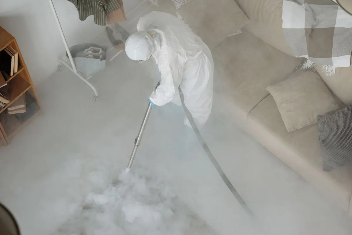 Biohazard cleanup technician in protective equipment, Enetai, WA